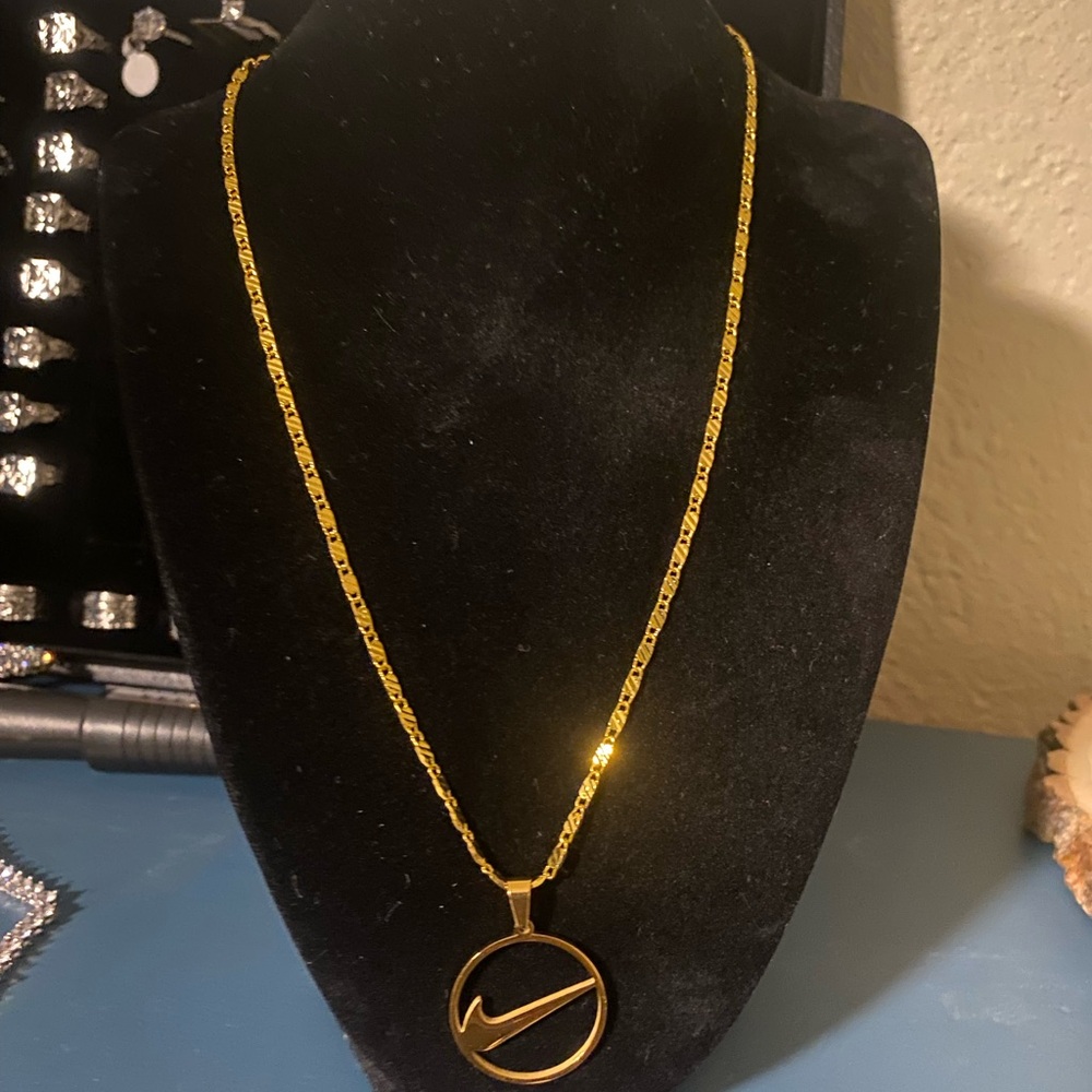 Gold Nike Pendant